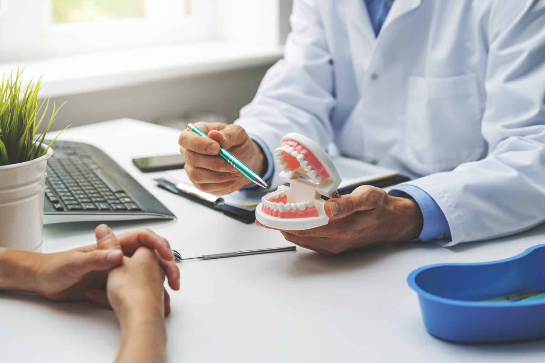dentist talking to patient